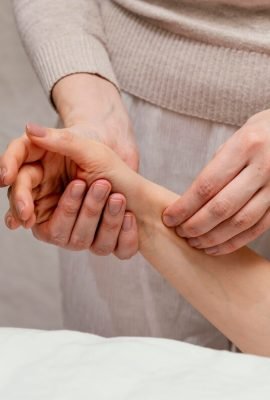 [freepicdownloader.com]-close-up-therapist-massaging-arm-medium
