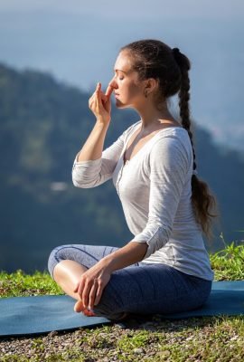 [freepicdownloader.com]-woman-practices-pranayama-lotus-pose-outdoors-large
