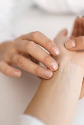 Doctor examining and giving advice to a patient about alternative and complimentary medicine. In the photo, there can be seen how doctor is taking patient's pulse.